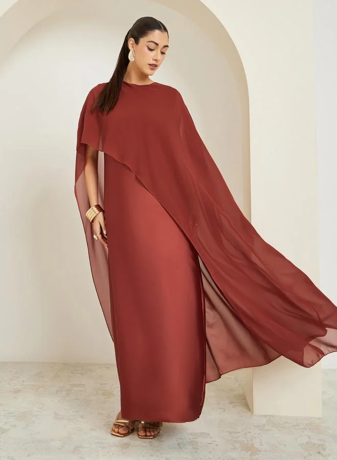 ستايلي فستان طويل بلون صدئي وأكمام كاب وقصة واسعة